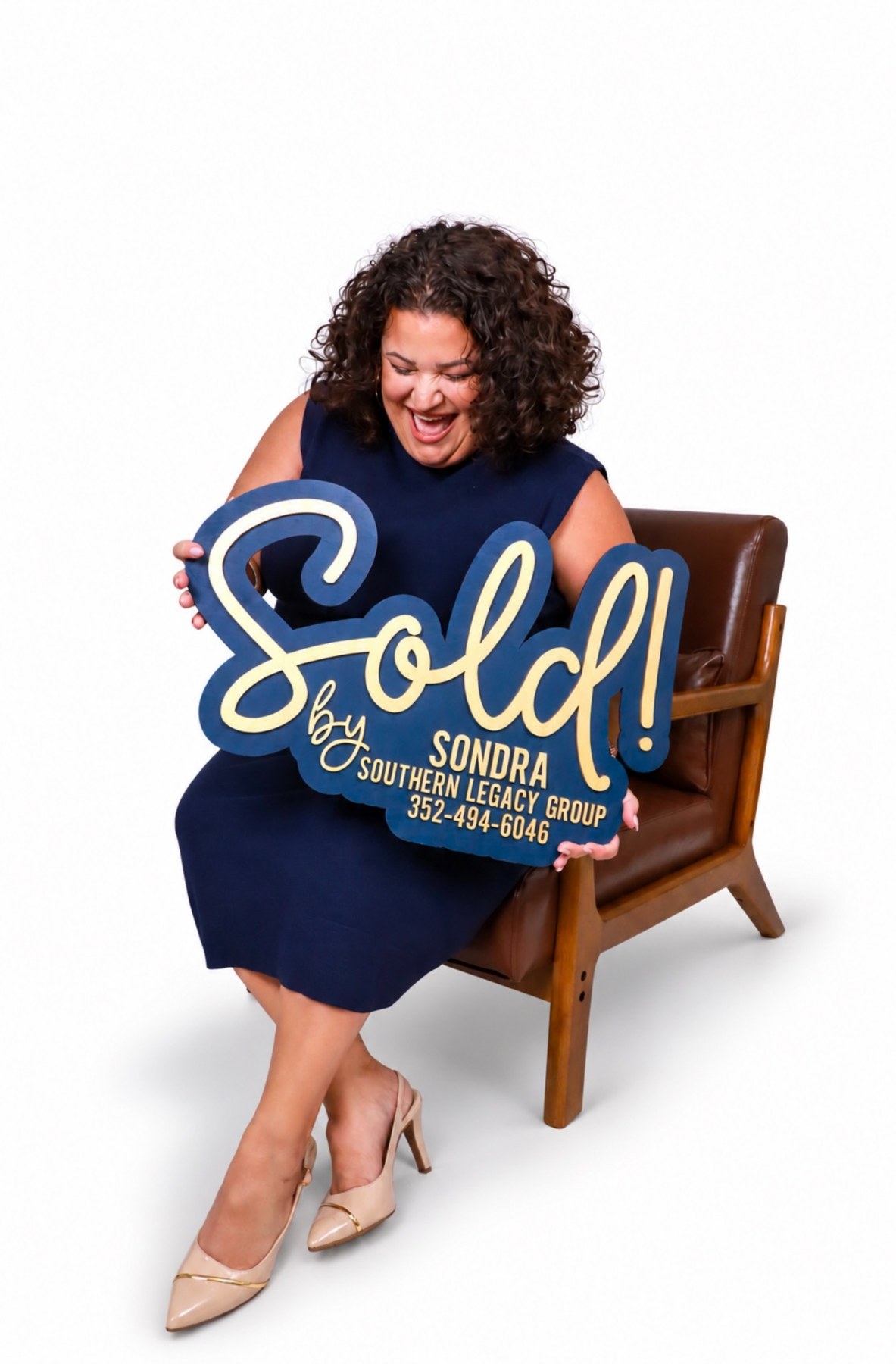Realtor branding portrait with a sold sign